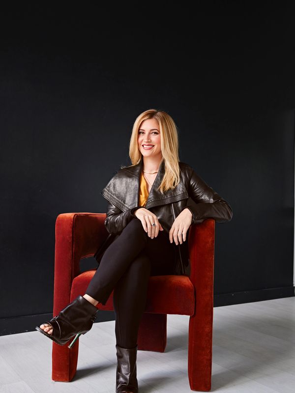 Nicole Sislen sitting in a chair.
