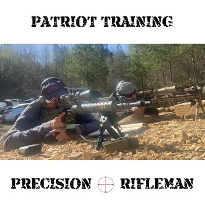 Two men aiming rifles during outdoor patriot training session.