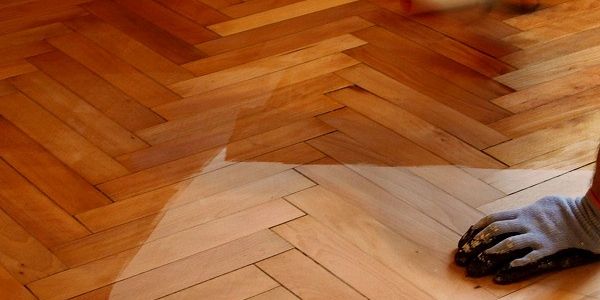 Wooden floor installation and polishing.