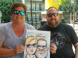 Couple holding their caricature at Opryland Resort , Nashville Tennessee