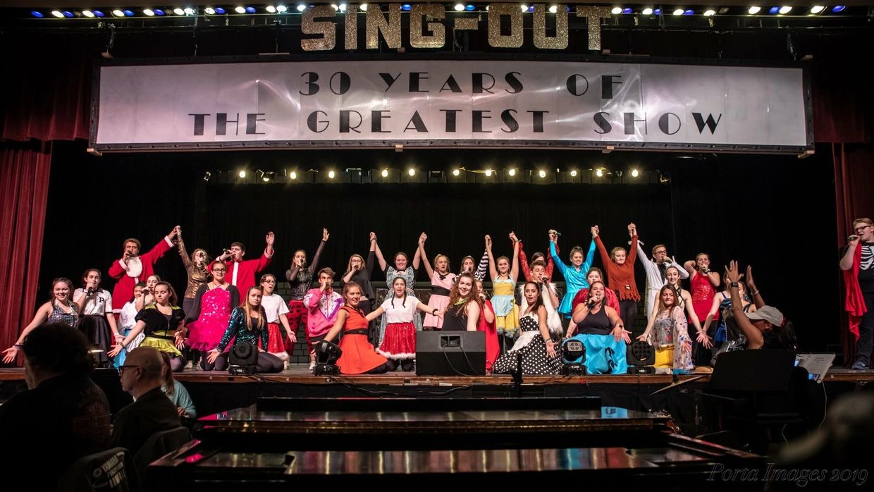 The cast of Sing-Out 2019 on stage.