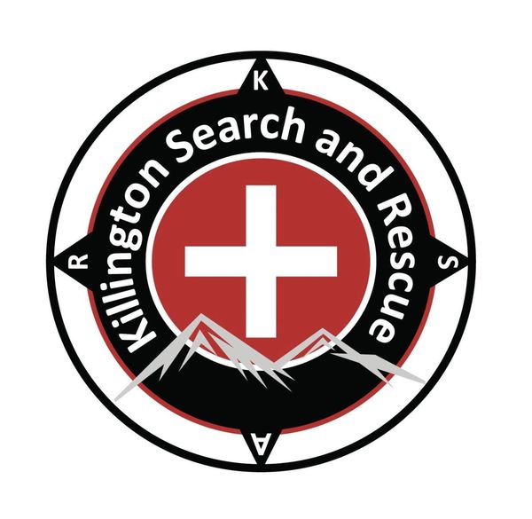 Killington Search and Rescue logo featuring a cross and mountains.