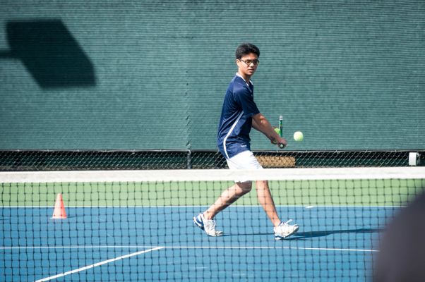 Player hitting a forehand on court