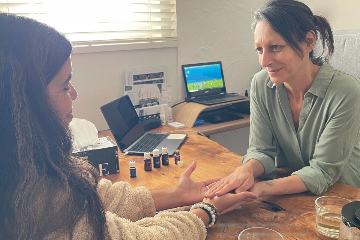 Two women having a hand reading session.