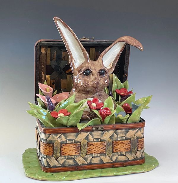 bunny in a basket full of flowers