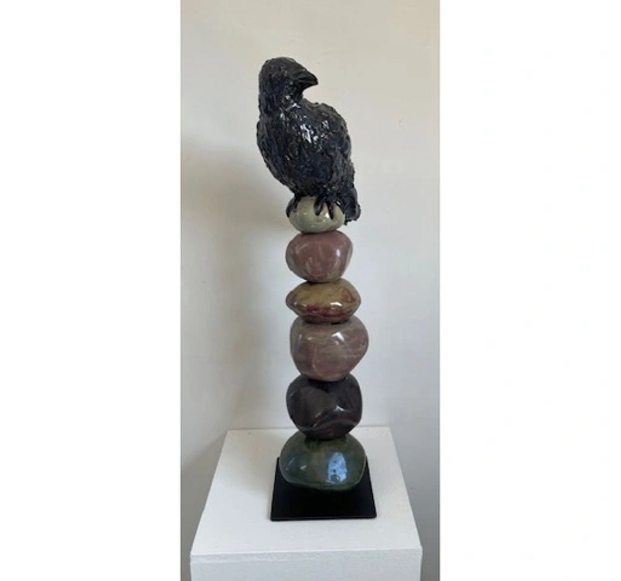 Raven on a Cairn of ceramic stones