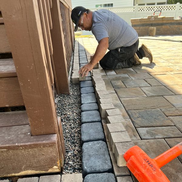 Man building stone wall