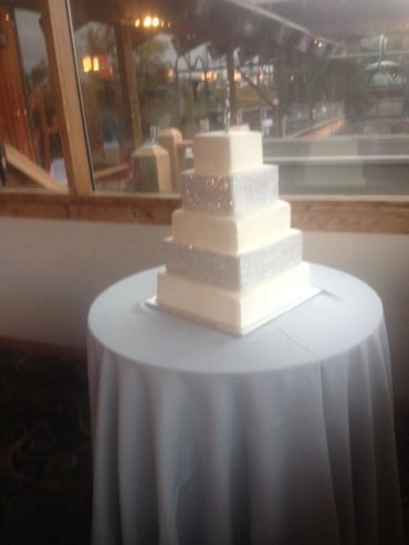 Bling cake.  Two tiers of this cake were fake cake.  Wedding  party was only 100 guests, but bride w