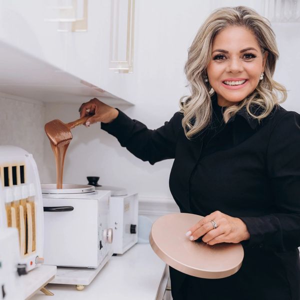Woman cooking with chocolate.