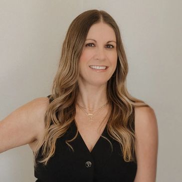 Jessica Fitzpatrick, Central Coast Realtor® with 7+ years of experience, smiling confidently in professional attire.