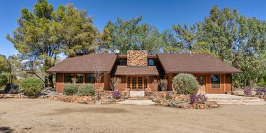 Atascadero, CA home with spacious lot, mature trees, pool & opportunity for additional living space.