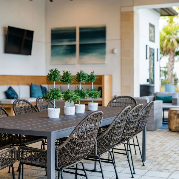 Modern outdoor dining area in Paso Robles, CA with wicker chairs.