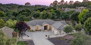 Arroyo Grande, CA home in The Highlands showcasing charming architecture & welcoming neighborhood.