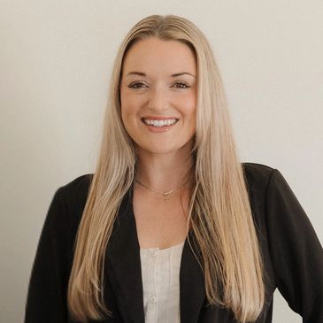 Allie Webber, Central Coast Realtor® and Certified Luxury Home Marketing Specialist™, smiling confidently in professional attire.