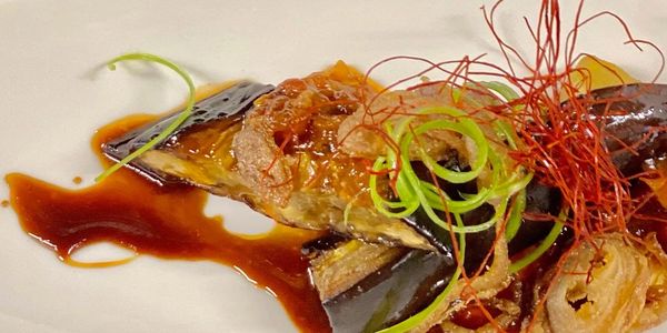 Bulgogi-style eggplant, crispy shallots, scallions, and chili threads.
