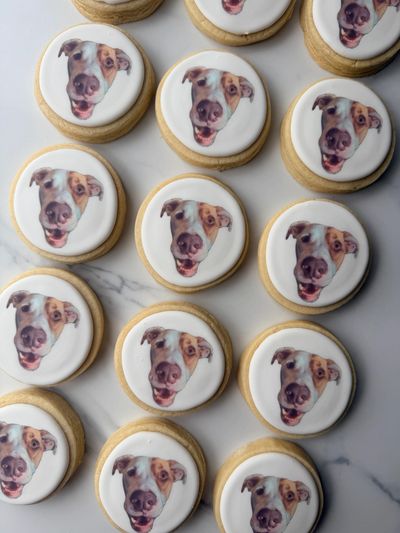 Cookies with a dog's face printed on icing.