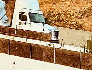 Temporary traffic screens, pedestrian barriers, wooden traffic screens shown in a freeway constructi