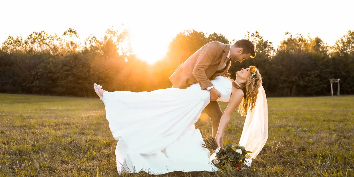 A couple dancing in a Kentucky field at a barn wedding