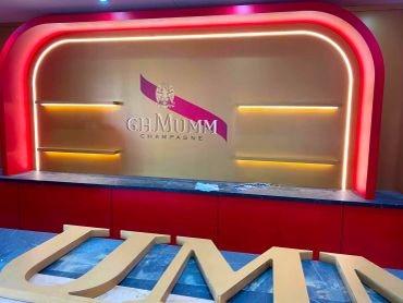 G.H. Mumm champagne display with illuminated sign.