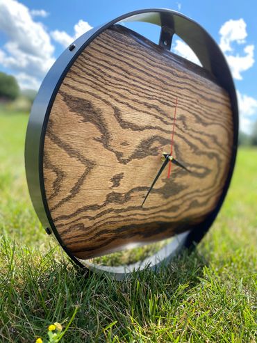 Oak Clock
16” metal ring with fitting to hang 
Simple design