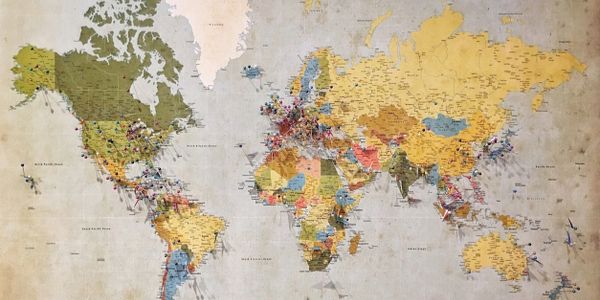 World map with colorful pins marking various locations across continents.