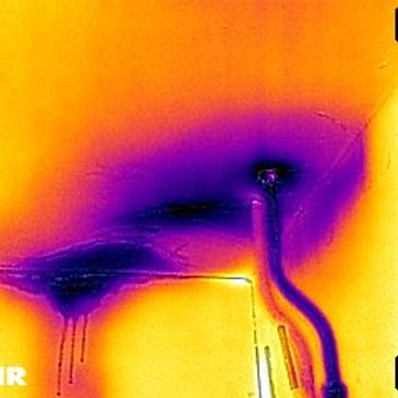 Thermal image on a leak detection survey.  Thermographic camera cold water leak flat roof ceiling.