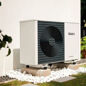 Air source heat pump - renewable energy in domestic home to heat water & radiator heating