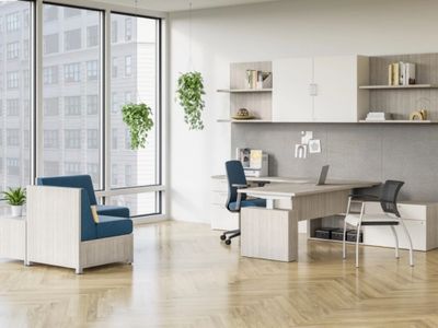 Modern office space with large windows, blue chairs, and wooden furniture.