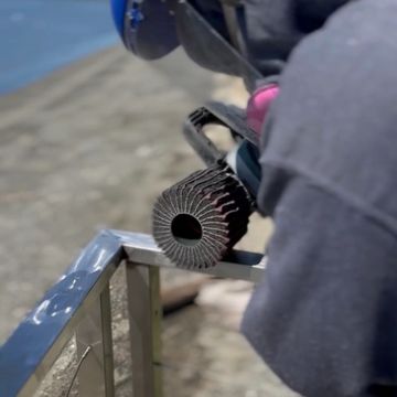 Professional onsite power polish on a metal railing.