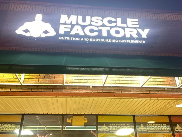 Muscle Factory vitamin nutrition store in Fort Mill, SC, featuring large storefront sign supplements