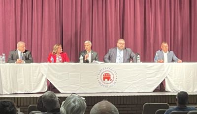 Panel discussion with five speakers at a Republican event.