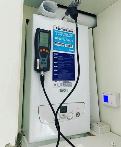 A Baxi boiler with attached diagnostic tool and control panel.