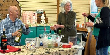 People enjoying the refreshment table at an event. 