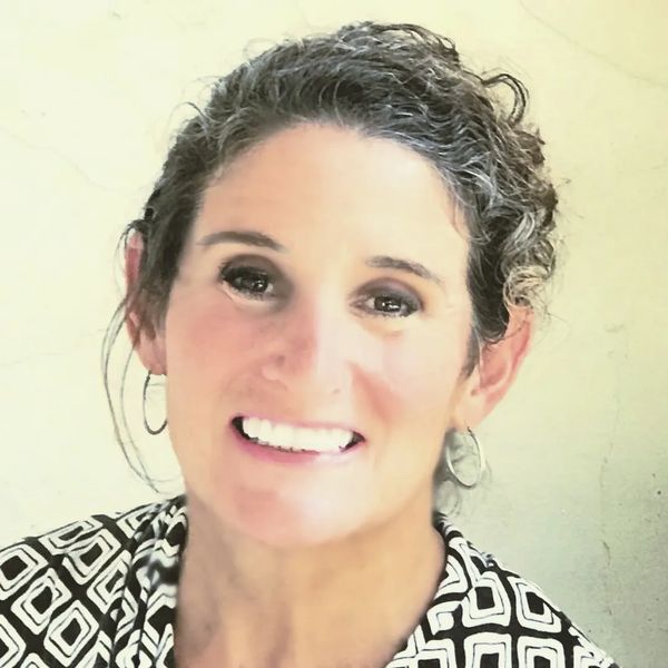 welcoming, kind, engaging, smiling mature woman 
