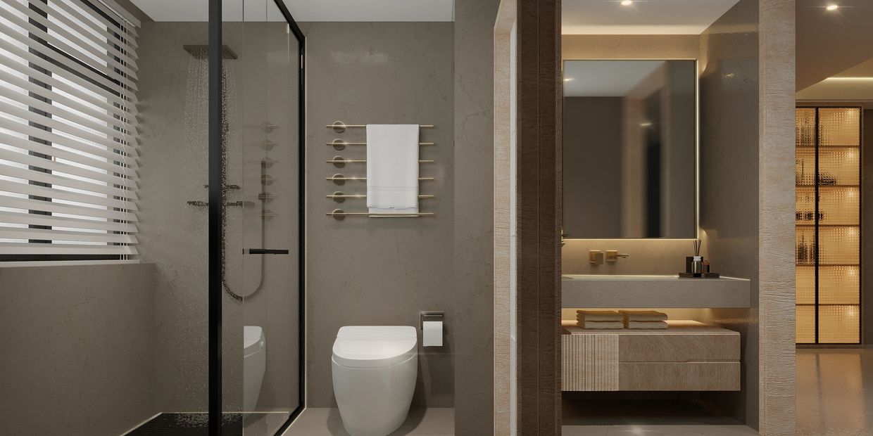 Modern bathroom with a glass shower, toilet, and illuminated vanity area.