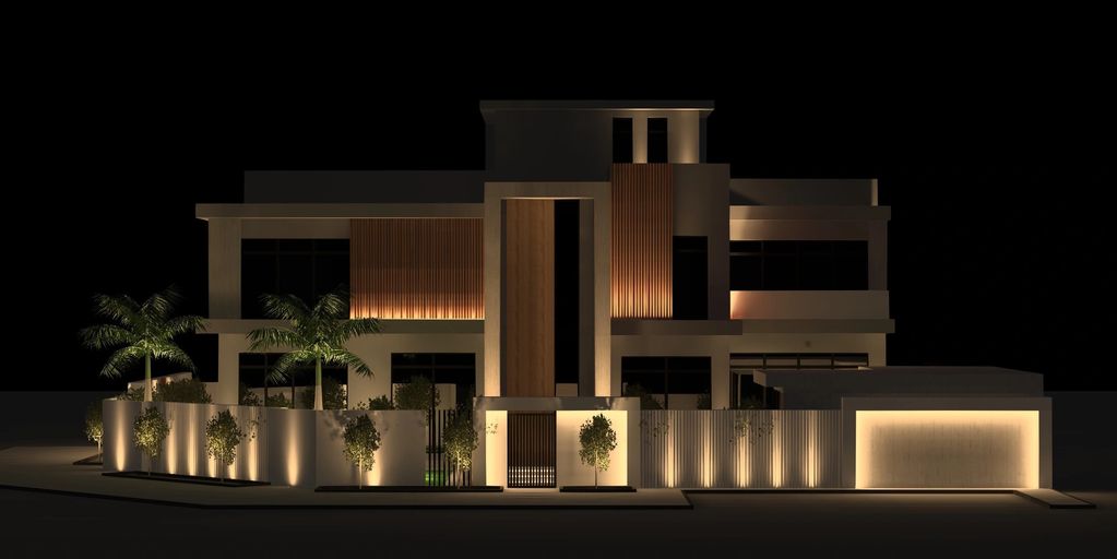 Modern house exterior illuminated with warm lighting at night.