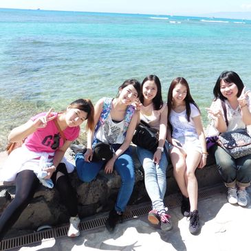 Japanese students at Waikiki Beach in Honolulu while studying abroad in Hawaii