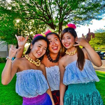 Students from Osaka, Japan in Hawaii having fun at a Hawaiian luau during their study abroad program.