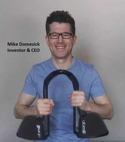 ABMILL CEO holding the Plank Trainer