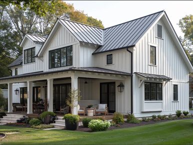 Modern farmhouse with white siding and black metal roof.