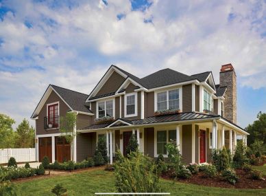 Modern two-story house with a large porch and garage.