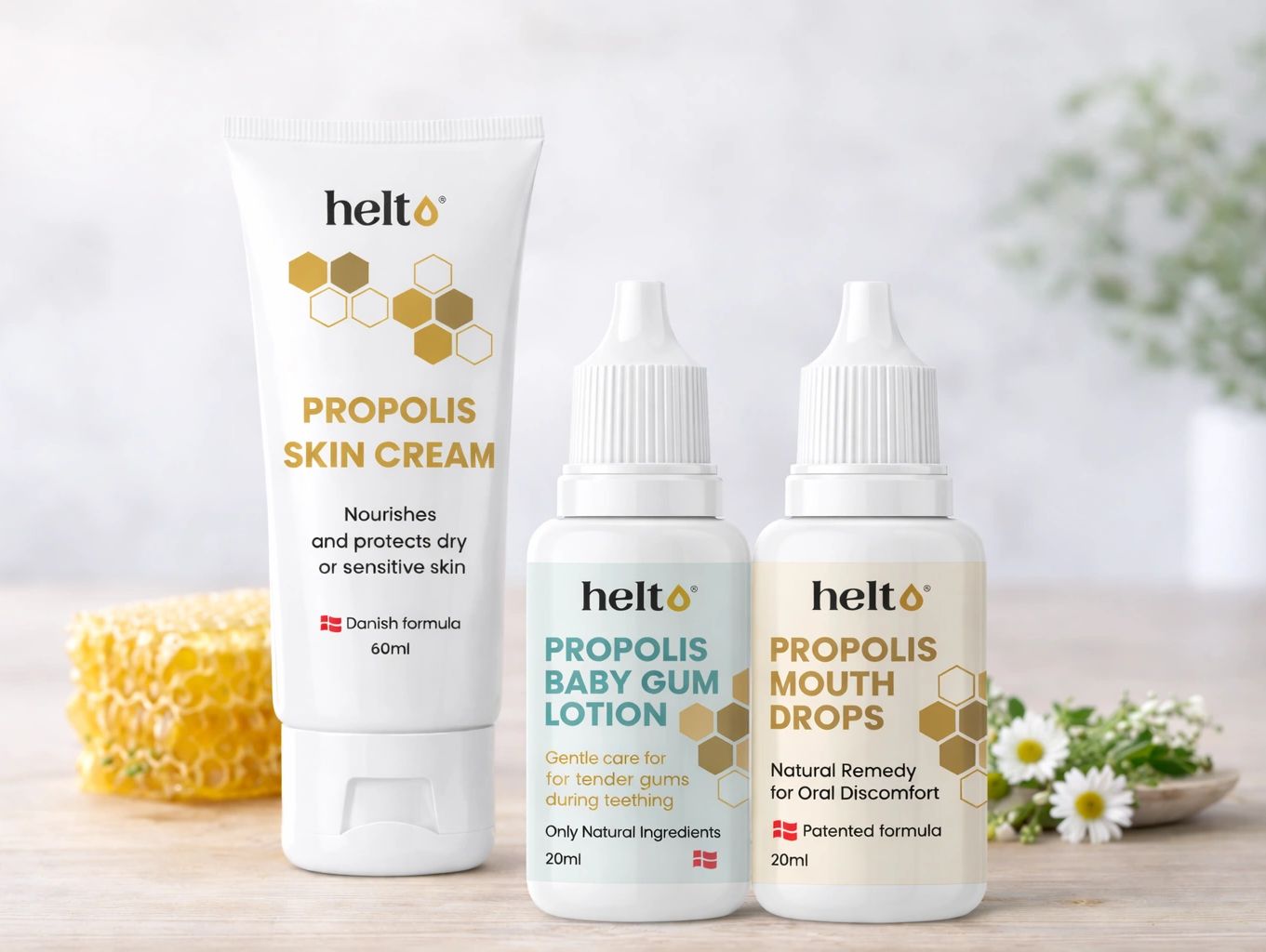 Three Helt propolis products including skin cream, baby gum lotion, and mouth drops.