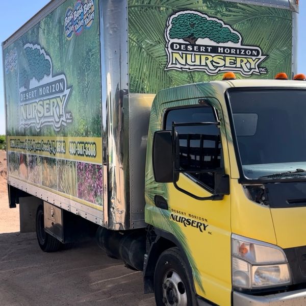 A Desert Horizon Nursery delivery truck with vibrant plant-themed graphics.