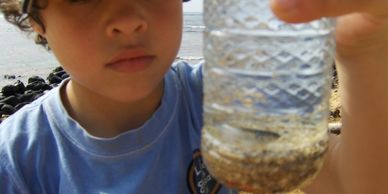 a kid holding a waterfall