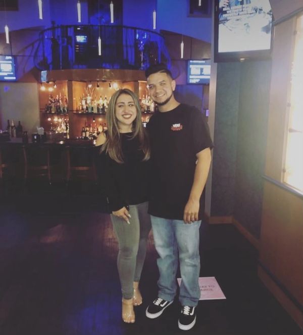 a man and a woman poosing for a pitcure 