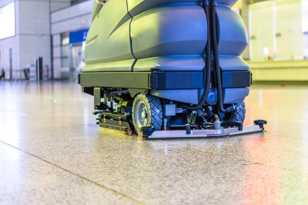 Floor care with washing machine in an office lobby.  