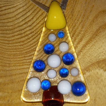 A glass ornament of a Christmas tree.