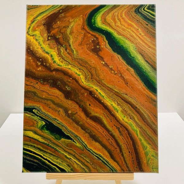 A pour painting with green, orange and yellow swirls.