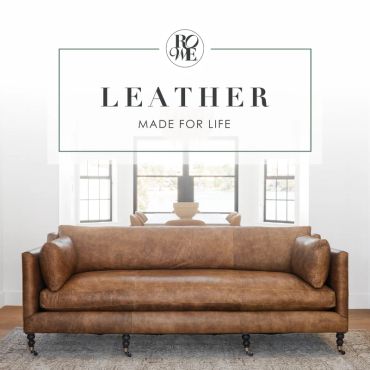 Brown leather sofa in a bright room.