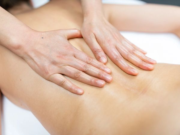 A woman getting her back massaged 